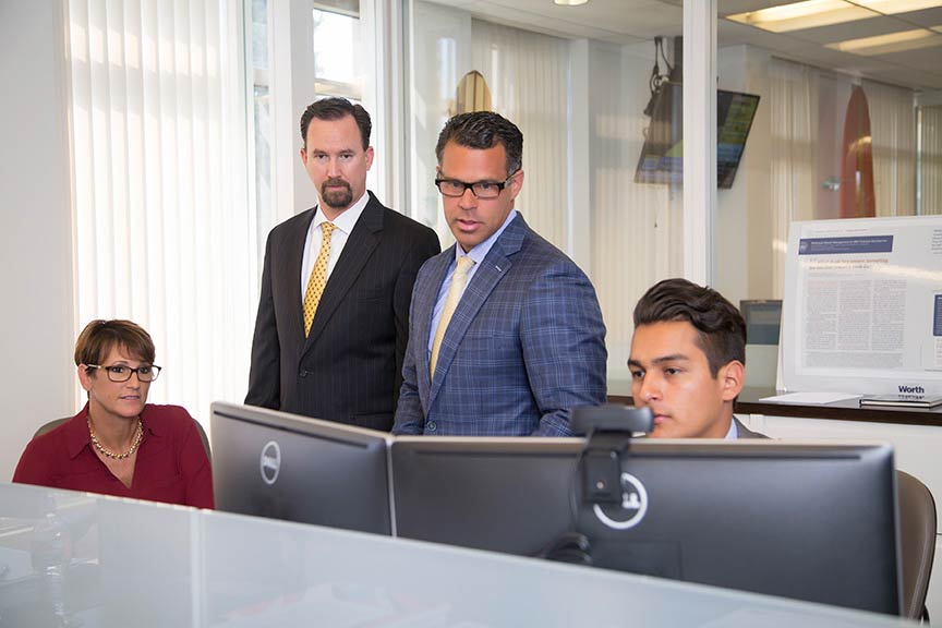 Corporate team looking at computer