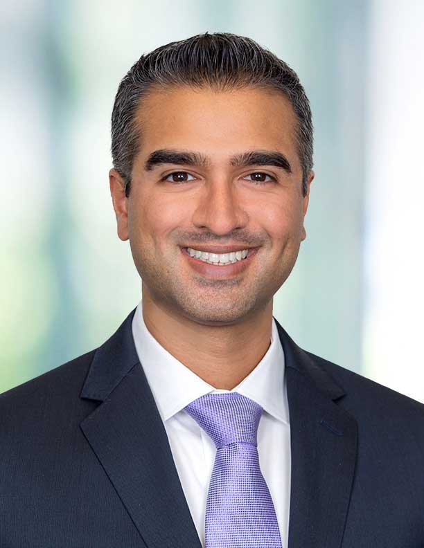 corporate headshot of lawyer on blurred background