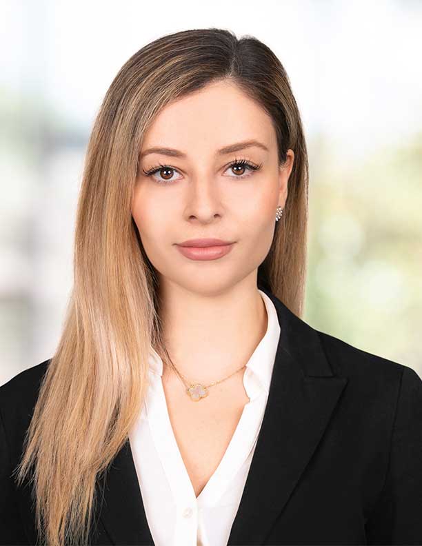 Corporate headshot of female lawyer shot on location at Newport Beach office with studio lighting