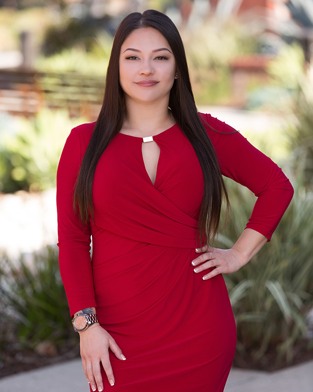 headshot of real estate agent woman in red