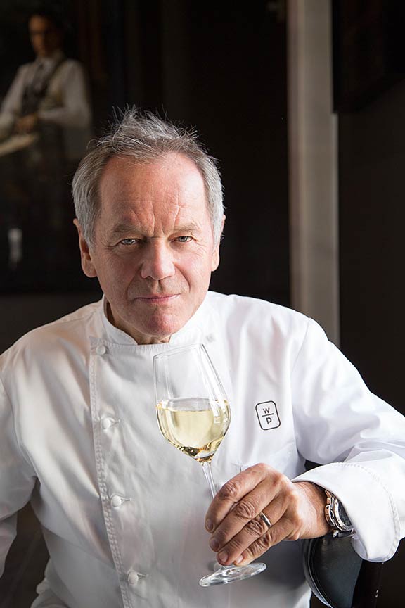 Portrait of Wolfgang Puck at his restaurant in Beverly Hills